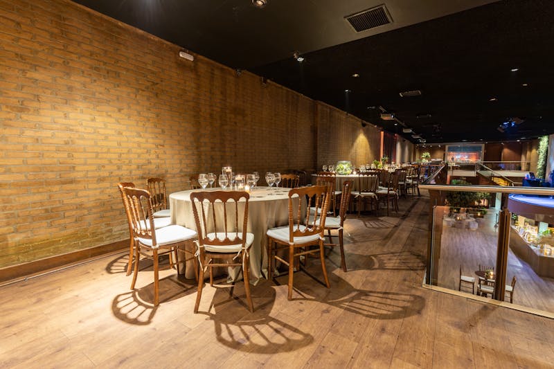 Cafe Rio interior — warm lighting, elegant table settings